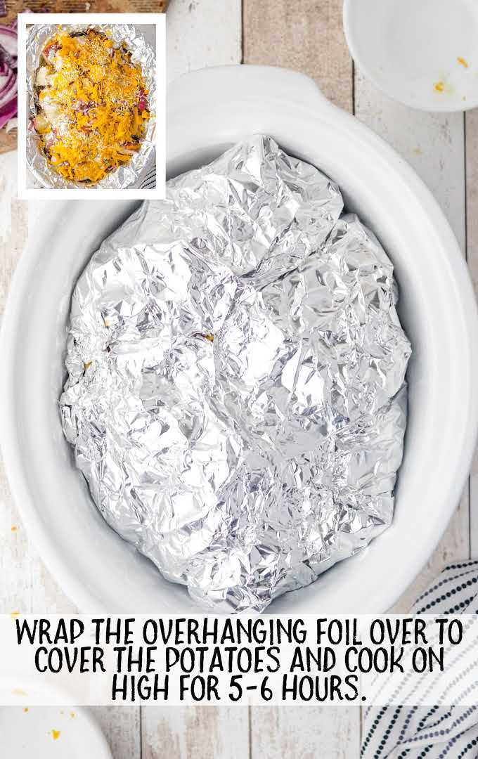 potatoes wrapped in foil in a crock pot