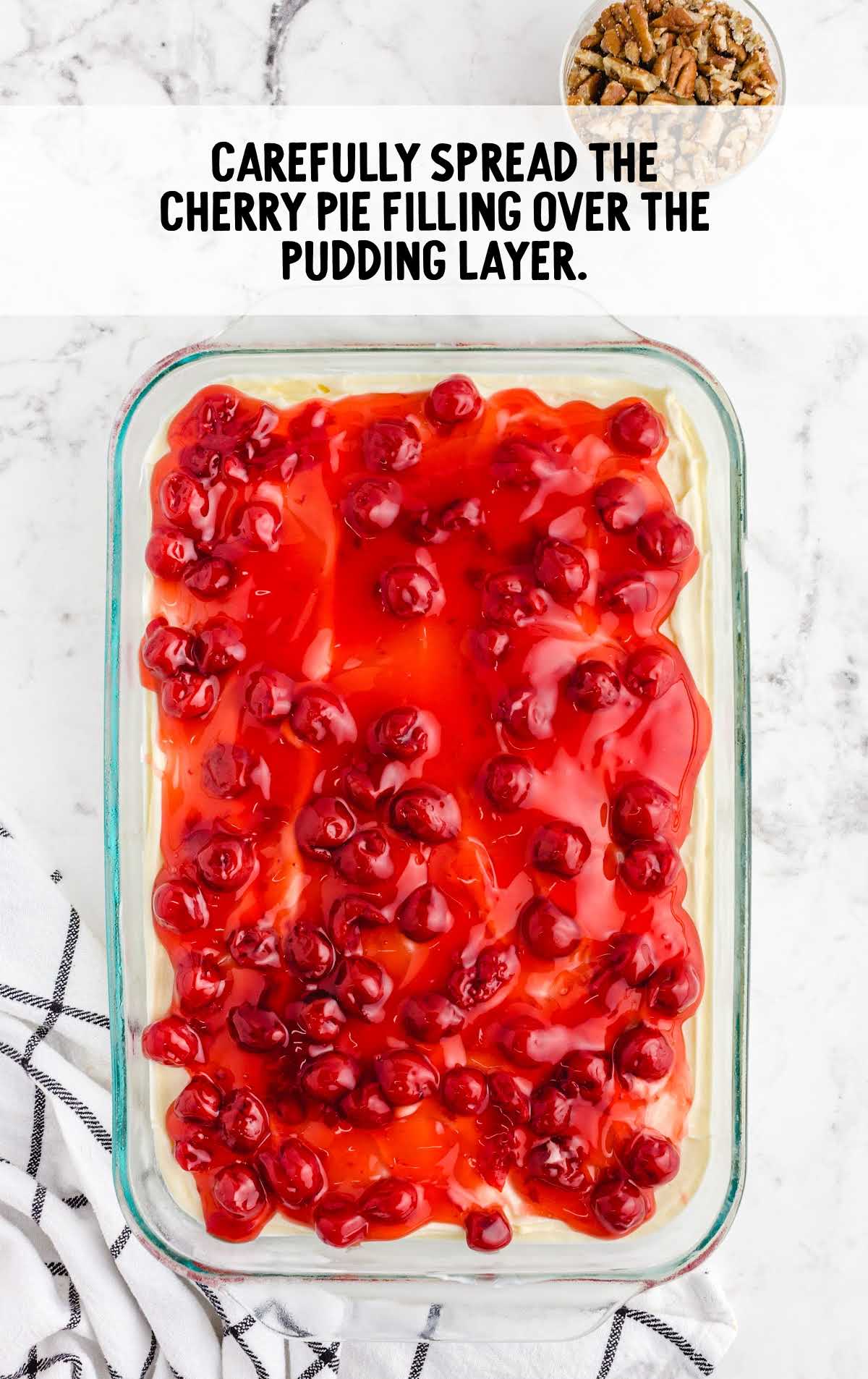 cherry pie filling spread over the pudding layer