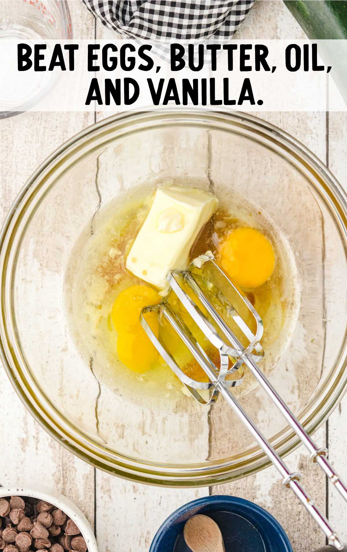 eggs, butter, oil, and vanilla whisked together in a bowl