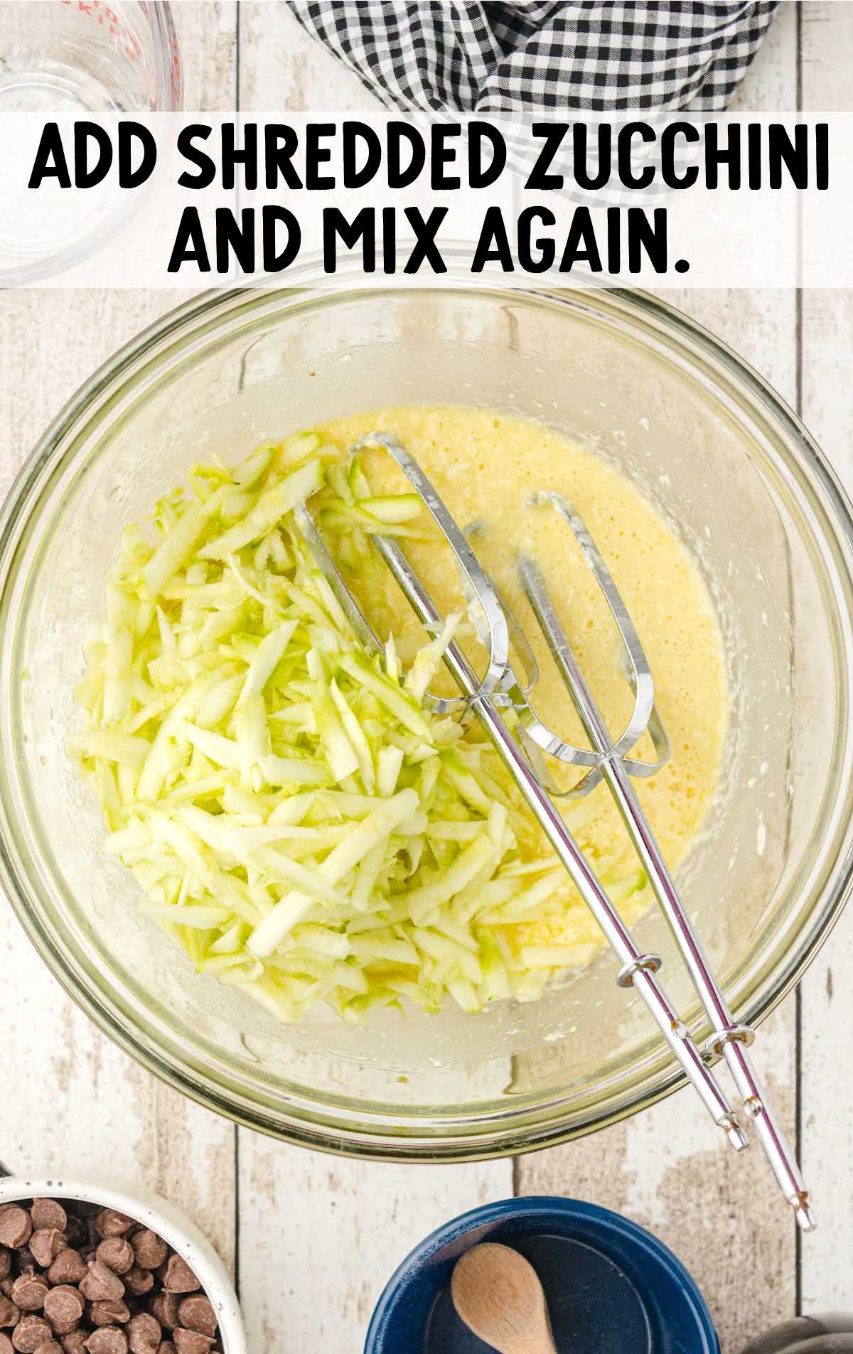 shredded zucchini whisked in the bowl