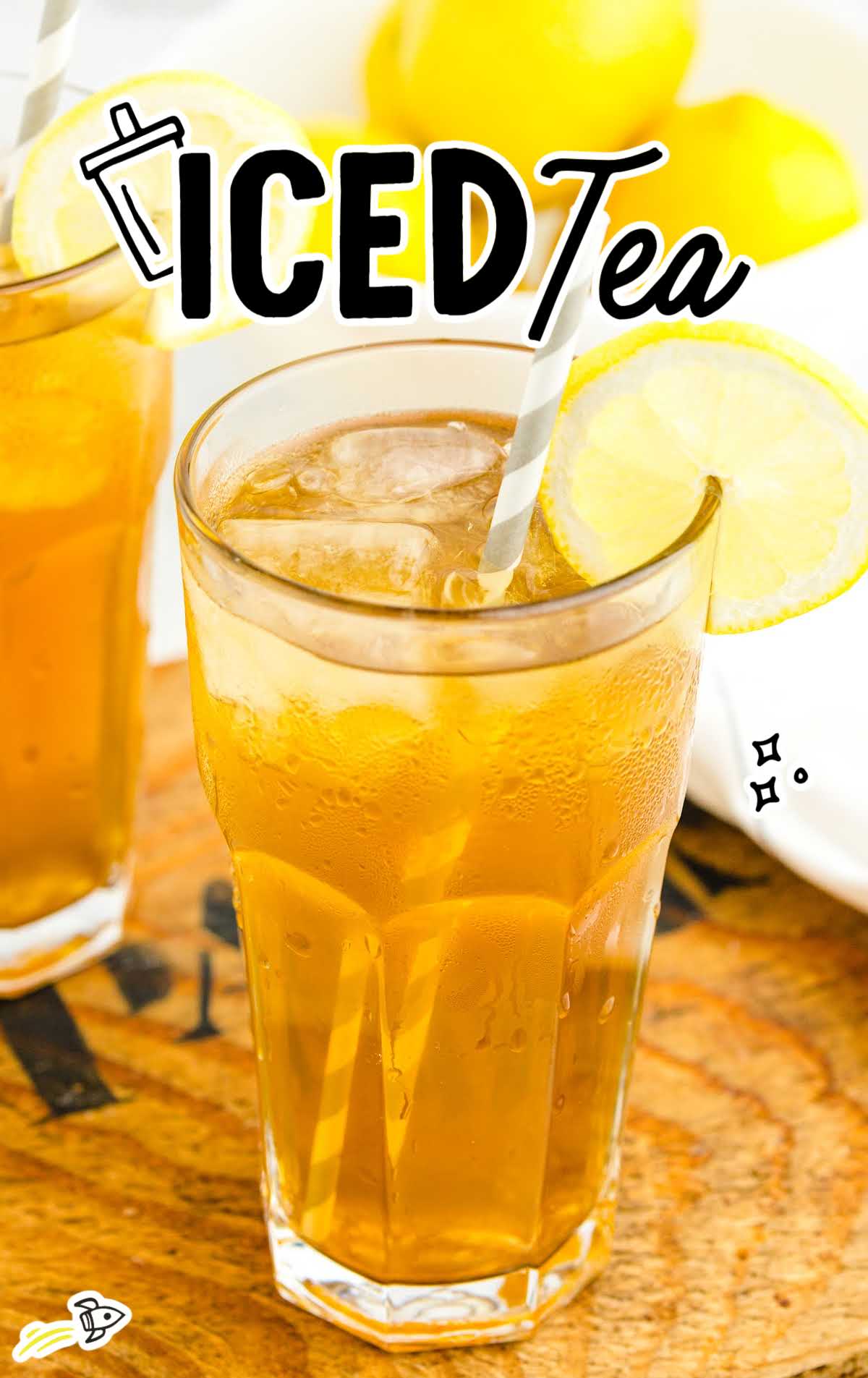 Tall glass of homemade iced tea with lemon slice and straw, labeled "Iced Tea"