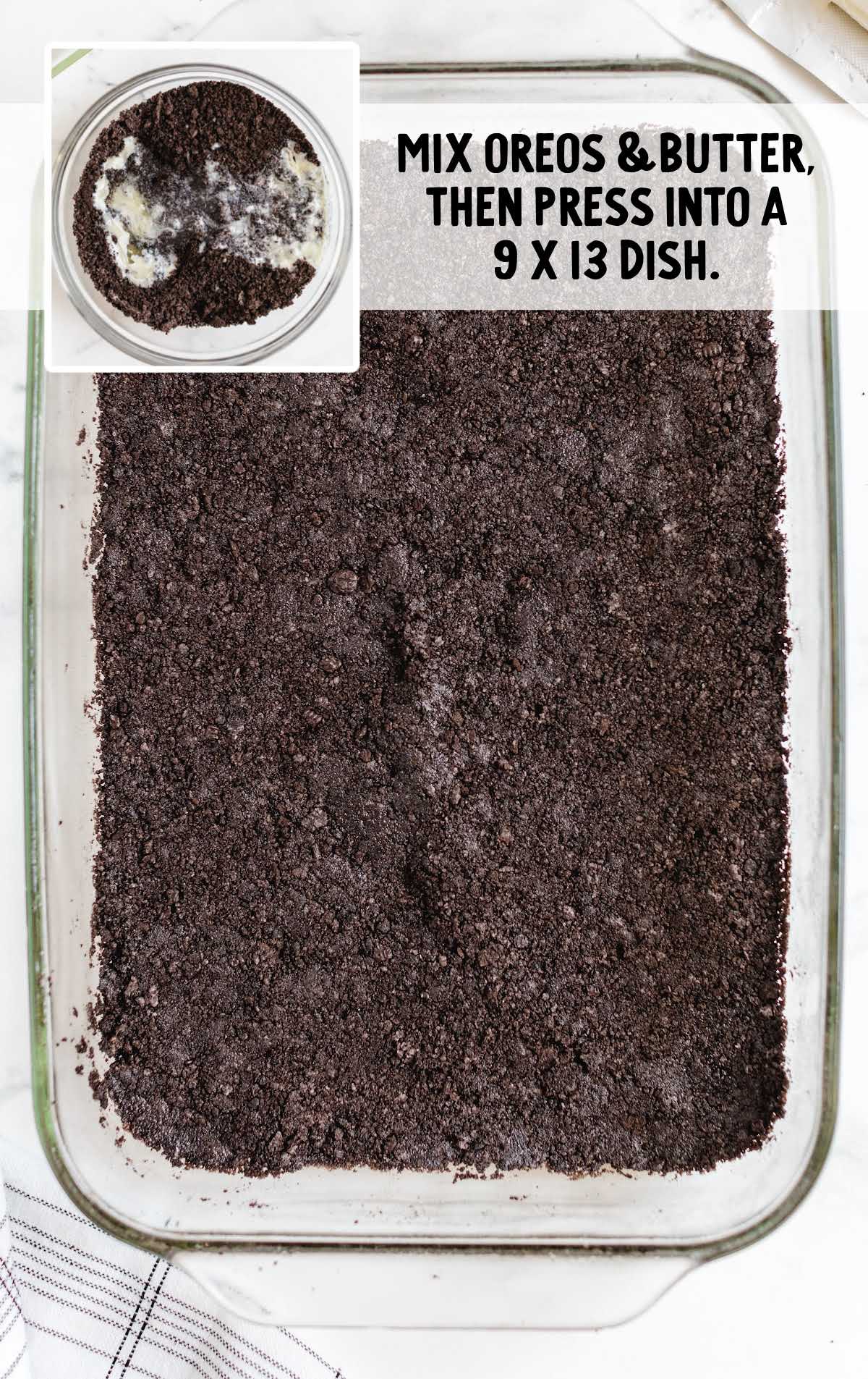 Crushed Oreo and butter mixture pressed into the bottom of a glass baking dish for the dessert lasagna crust.