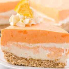 a slice of Orange Creamsicle Cake on a plate