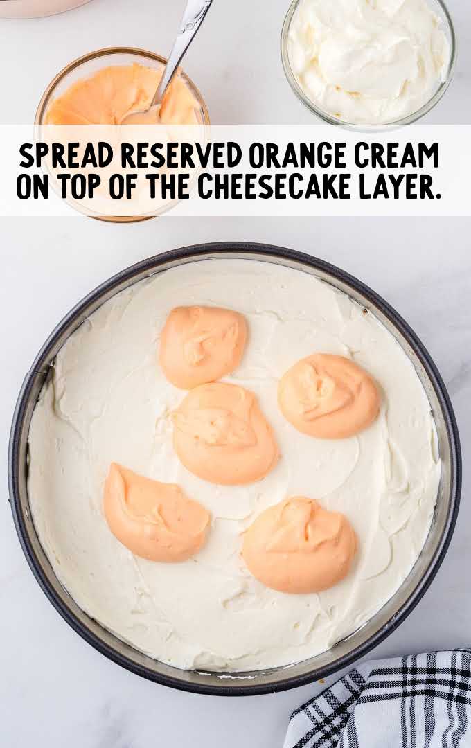 no-bake orange creamsicle cheesecake process shot of orange cream placed on top of cream cheese layer