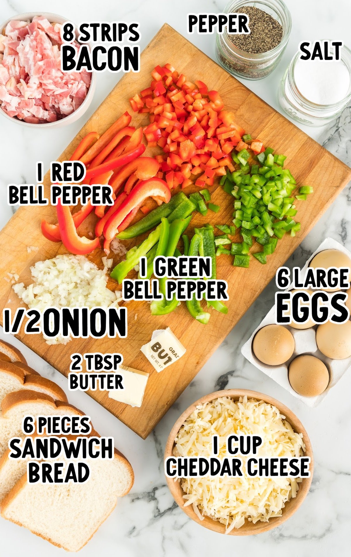 Flat lay of omelet in a hole ingredients including peppers, eggs, bacon, bread, and cheese.