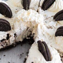 A piece of cake on a plate, with Oreo and Cream