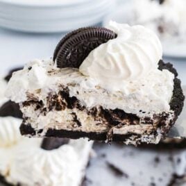 close up shot of a Oreo Pie topped with whipped cream and Oreos