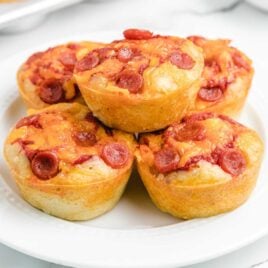 close up shot of Pizza Muffins piled on a plate