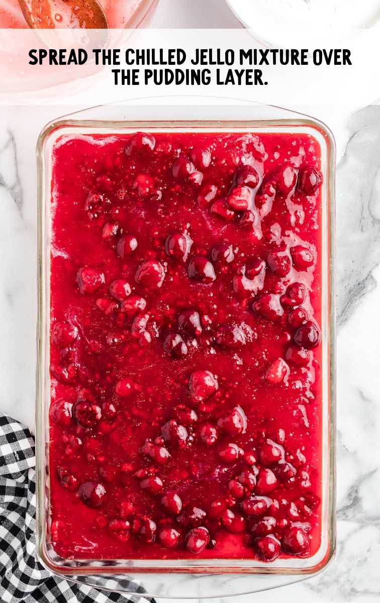 raspberry lasagna process shot of jello mixture in a baking pan