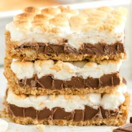close up shot of s'mores bars stacked on top of each other