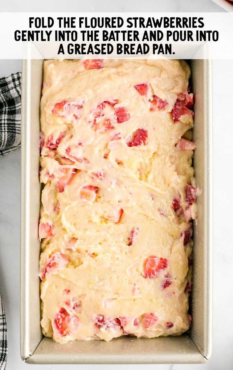 batter poured into baking pan and topped with strawberries