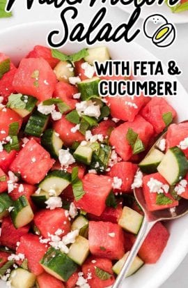 close up overhead shot of a serving of watermelon salad topped with mint leaves and feta cheese in a bowl