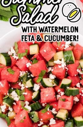 close up overhead shot of a serving of watermelon salad topped with mint leaves and feta cheese in a bowl