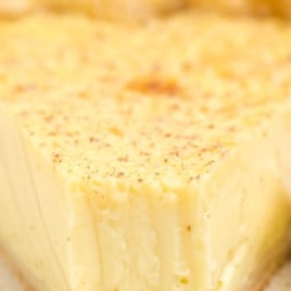 Slice of custard pie dusted with nutmeg and labeled “40’s vintage custard pie – old fashioned easy recipe”