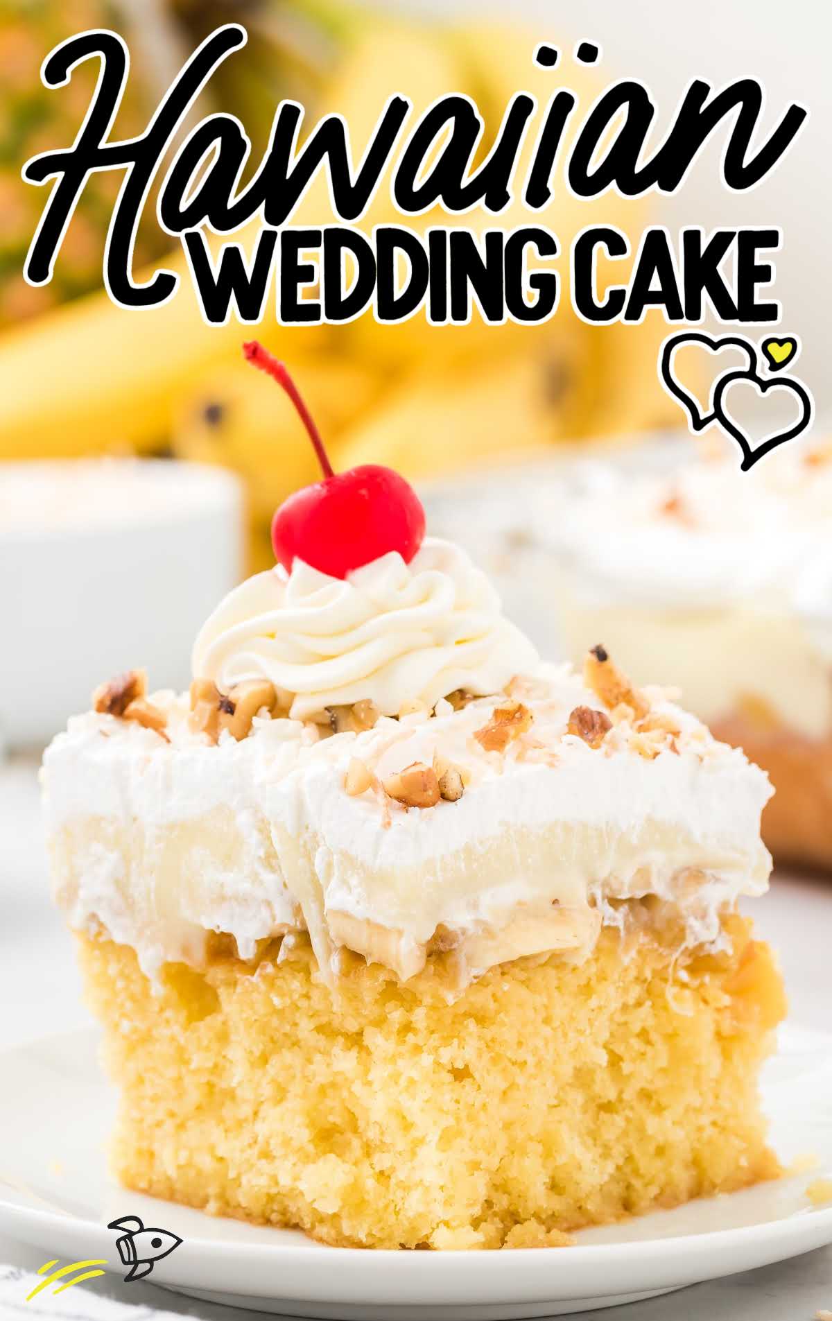 a slice of Hawaiian wedding cake topped with walnuts, cool whip, and a cherry on a plate