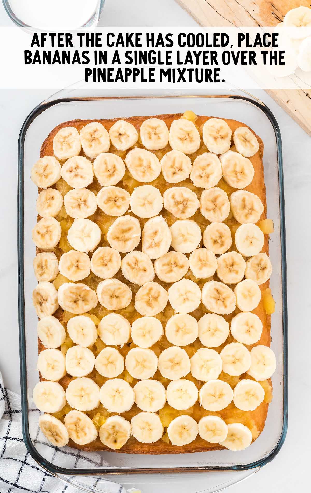 banana slices placed over cake