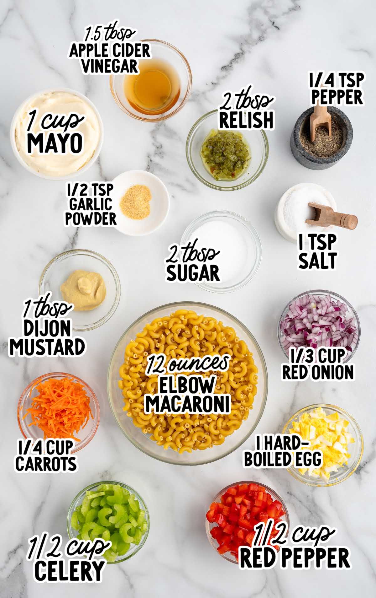Flat lay of measured ingredients for macaroni salad including elbow macaroni, mayo, relish, red pepper, celery, and seasonings.