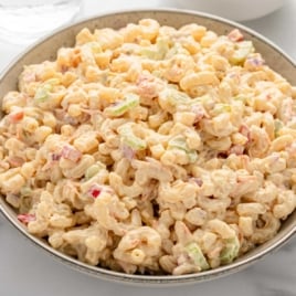 Creamy macaroni salad in a serving bowl.