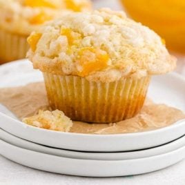 close up shot of peach cobbler muffins on a plate