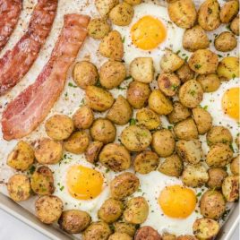 close up shot of sheet pan breakfast garnished with parsley in a sheet pan