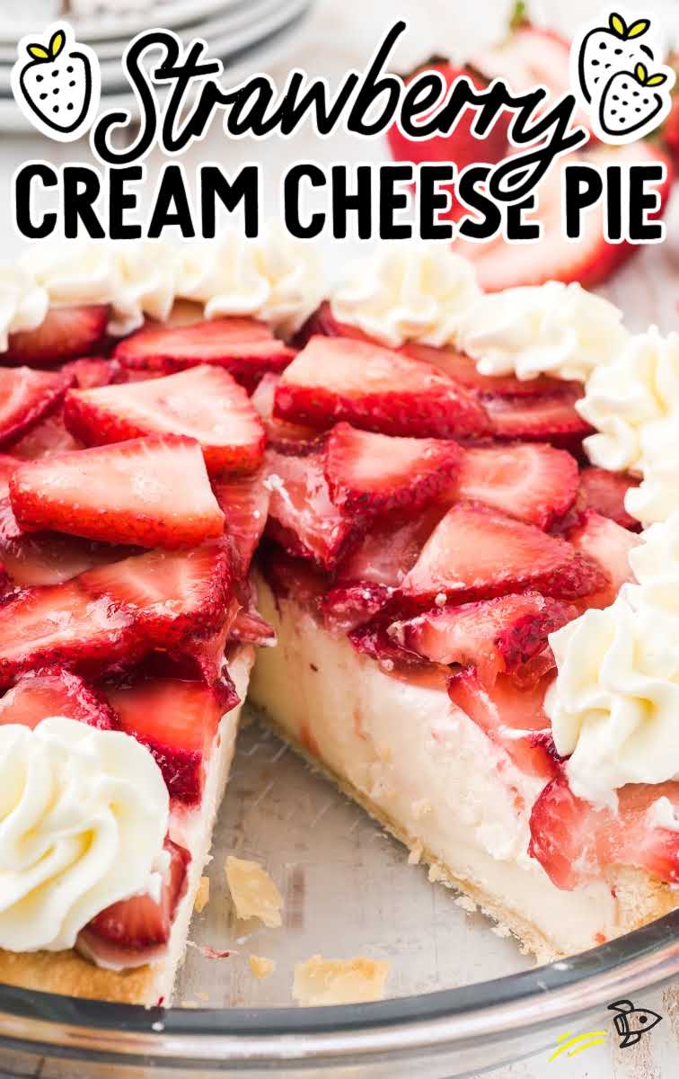 close up shot of strawberry cream cheese pie with sliced strawberries and a whipped topping in a clear pie dish