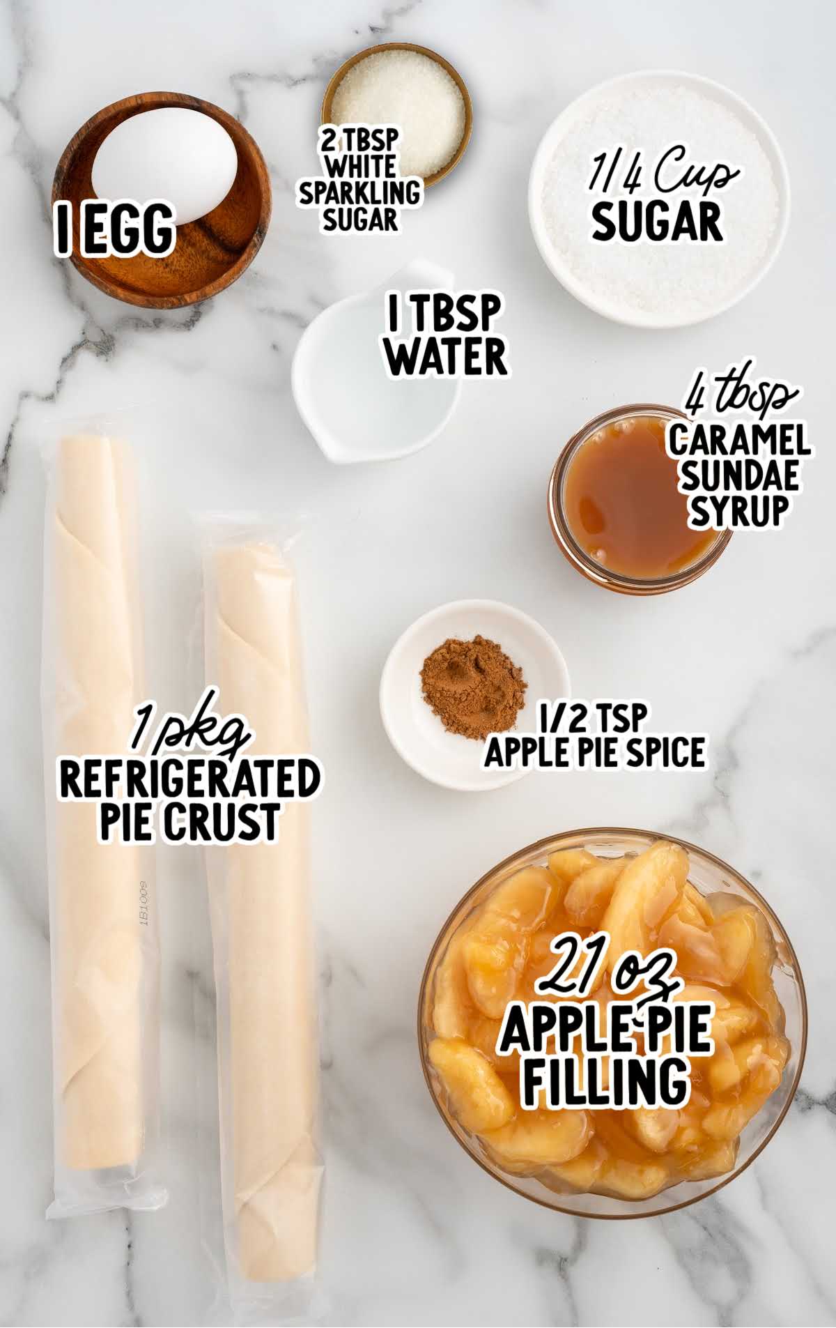 Overhead image of ingredients including pie crust, apple pie filling, caramel syrup, sugar, and spices labeled for apple pie cookies.
