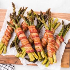 Bacon Wrapped Asparagus on a wooden board