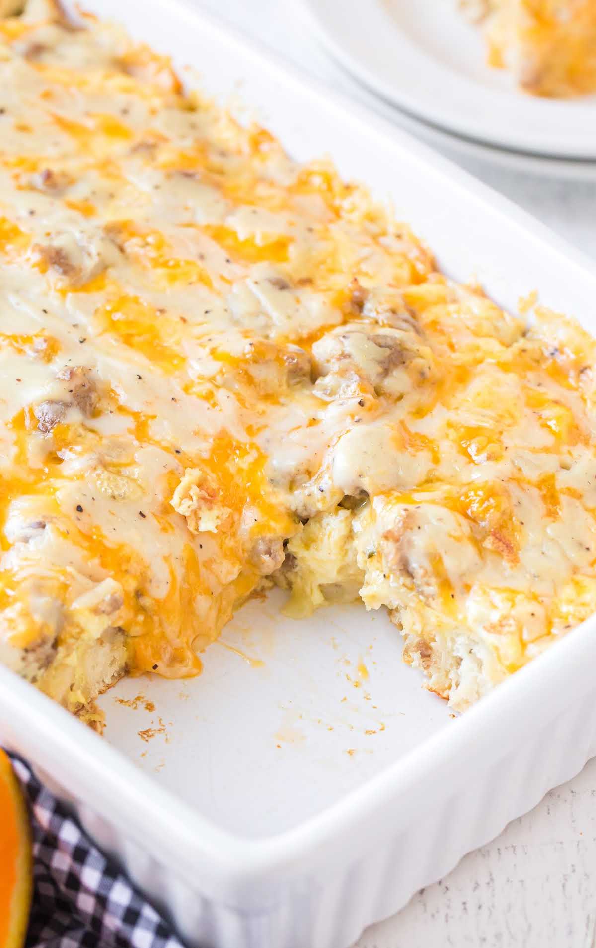 close up shot of biscuits and gravy breakfast casserole in a baking dish