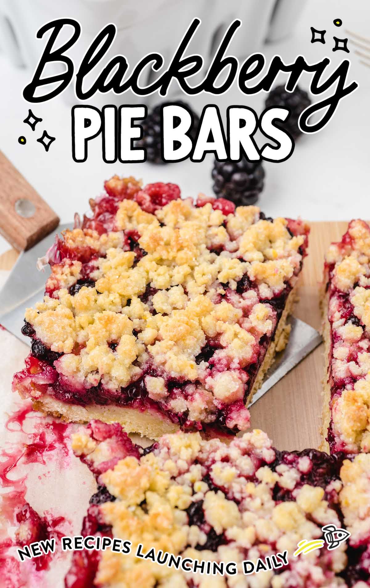 close up shot of Blackberry Pie Bars being picked up with a spatula