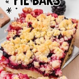 close up shot of Blackberry Pie Bars being picked up with a spatula