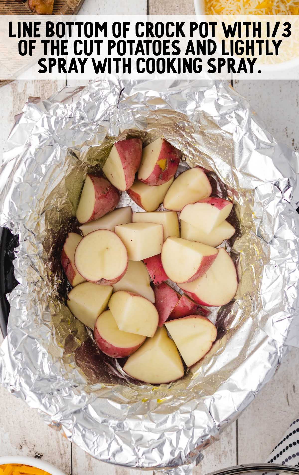 potatoes placed in a crock pot