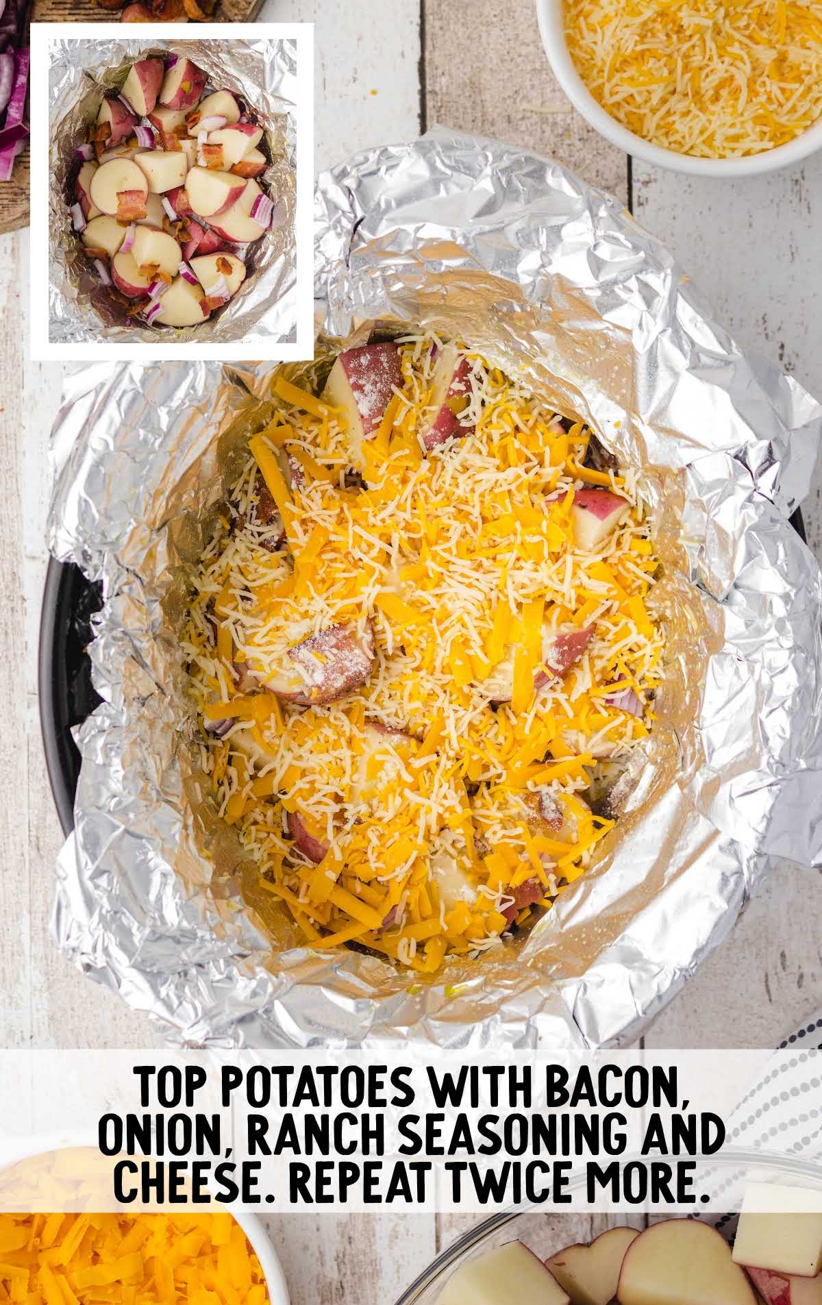 potatoes topped with cheese in a crock pot