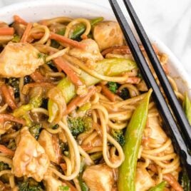 close up overhead shot of a bowl of Chicken Lo Mein with chopsticks