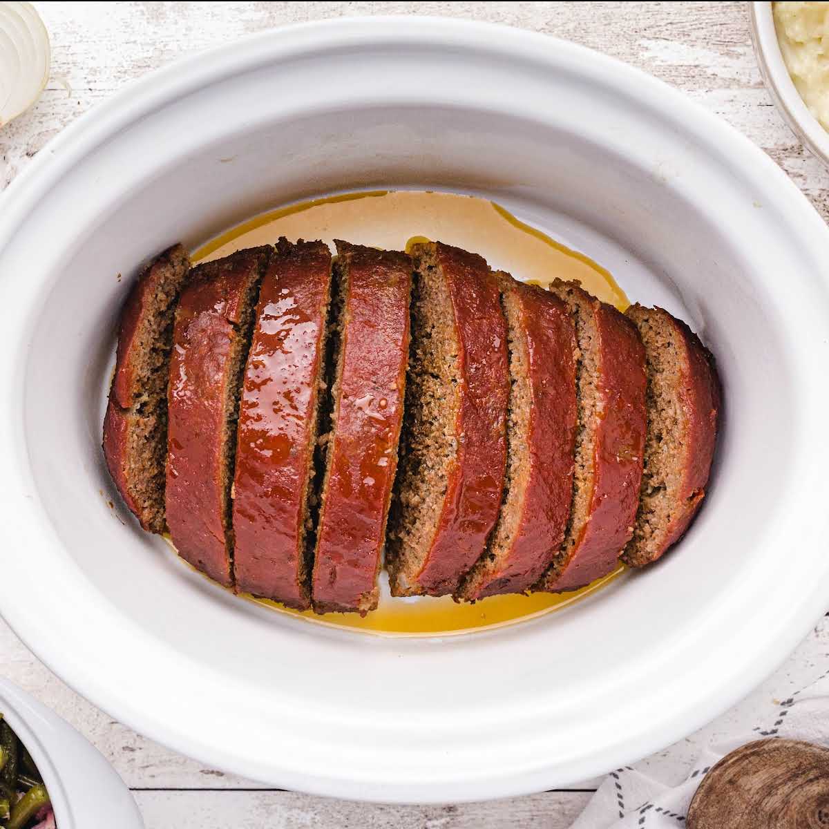 Meatloaf sliced in a crockpot