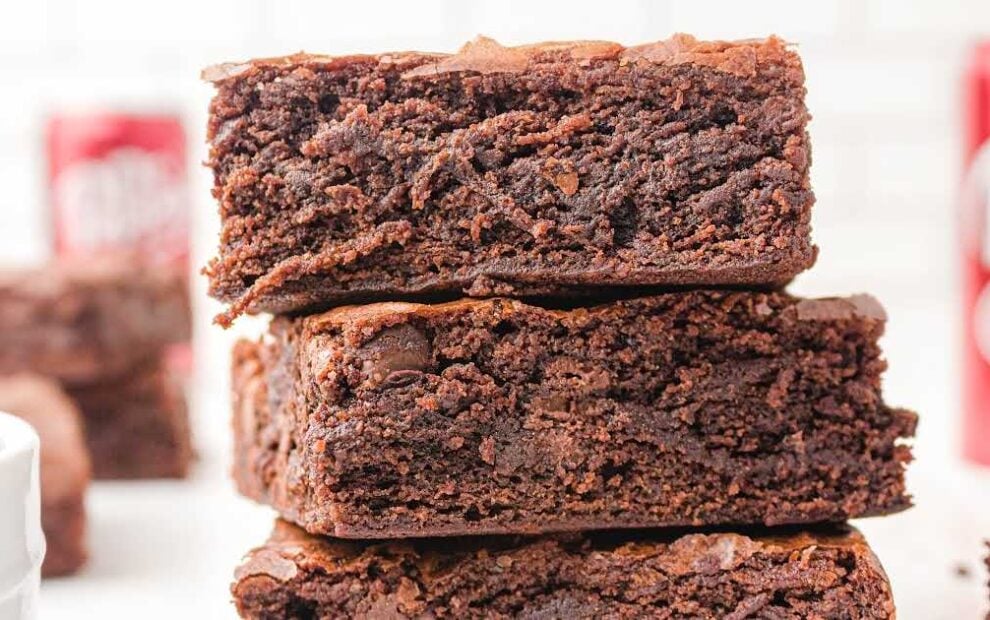 close up shot of Dr Pepper Brownies stacked on top of each other