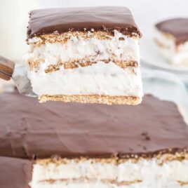 close up shot of a slice of Eclair Cake on a spatula