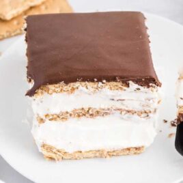 close up shot of a slice of Eclair Cake on a plate