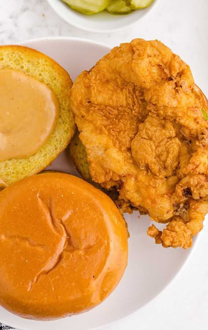 close up shot of fried chicken sandwich on a plate