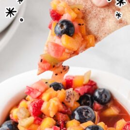 a close up shot of Fruit Salsa with Cinnamon Chips in a plate