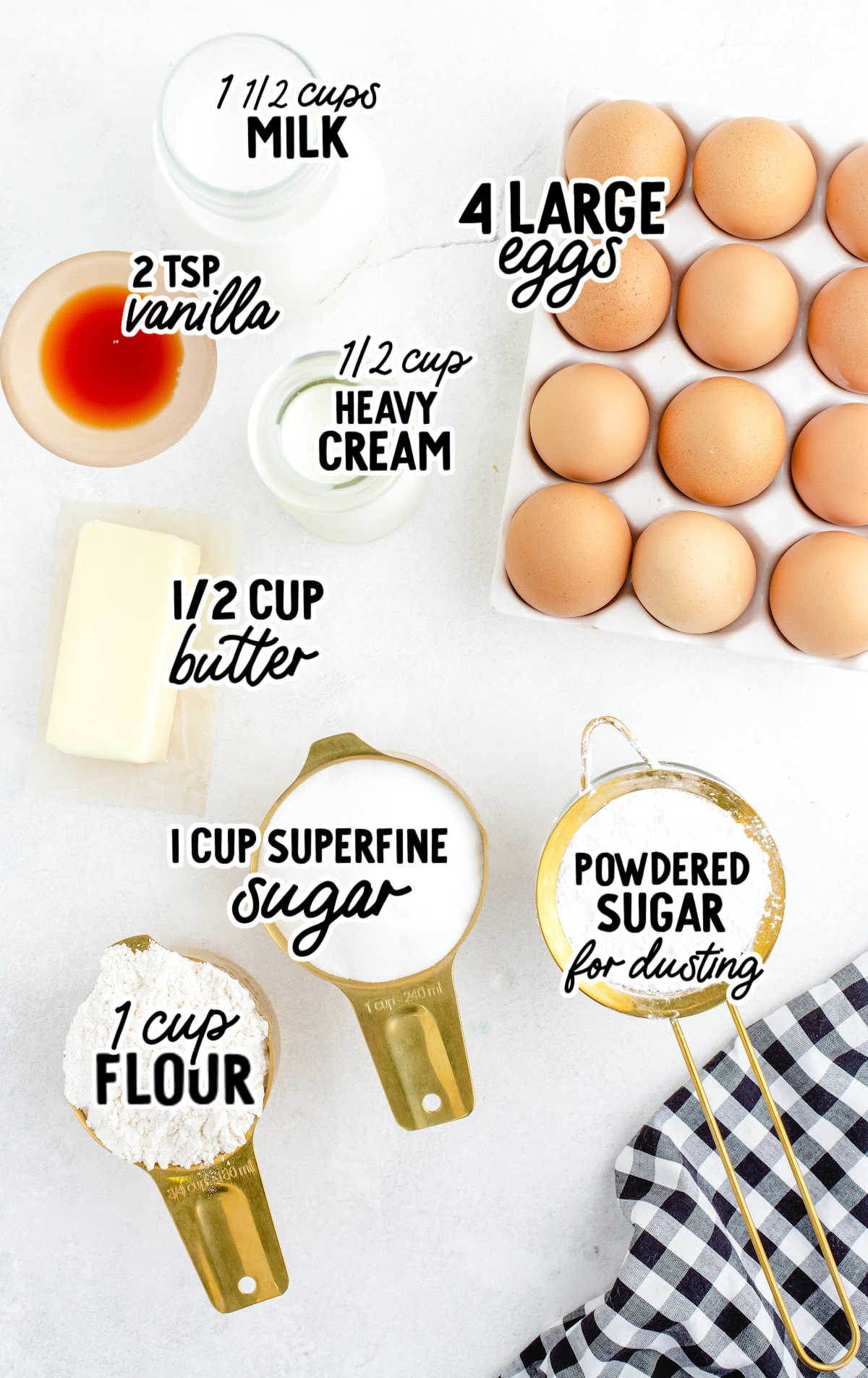 Flat lay of ingredients for magic custard cake including eggs, milk, butter, flour, sugar, and vanilla extract, all labeled.