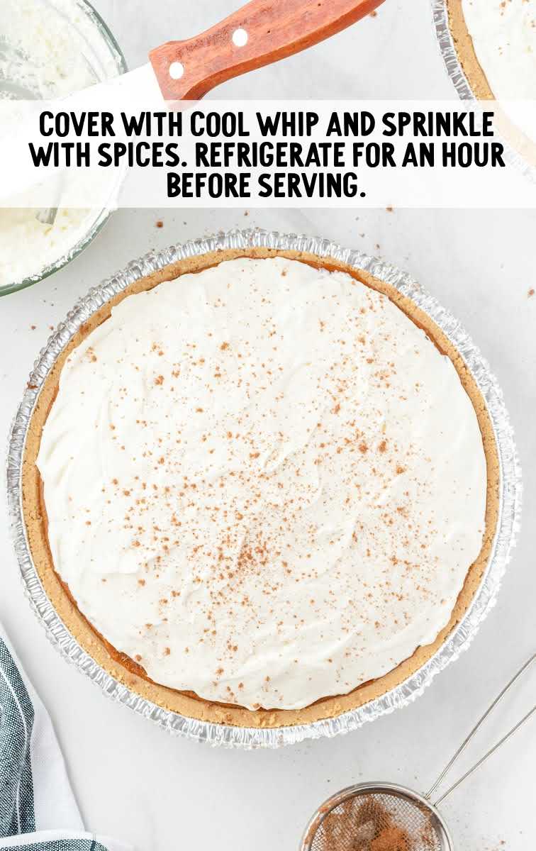pie topped with cool whip and spices