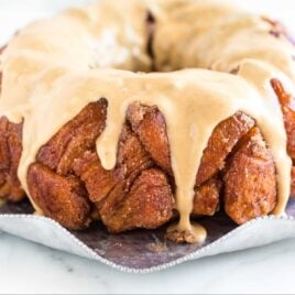 close up shot of Peanut Butter Monkey Bread drizzled with glaze