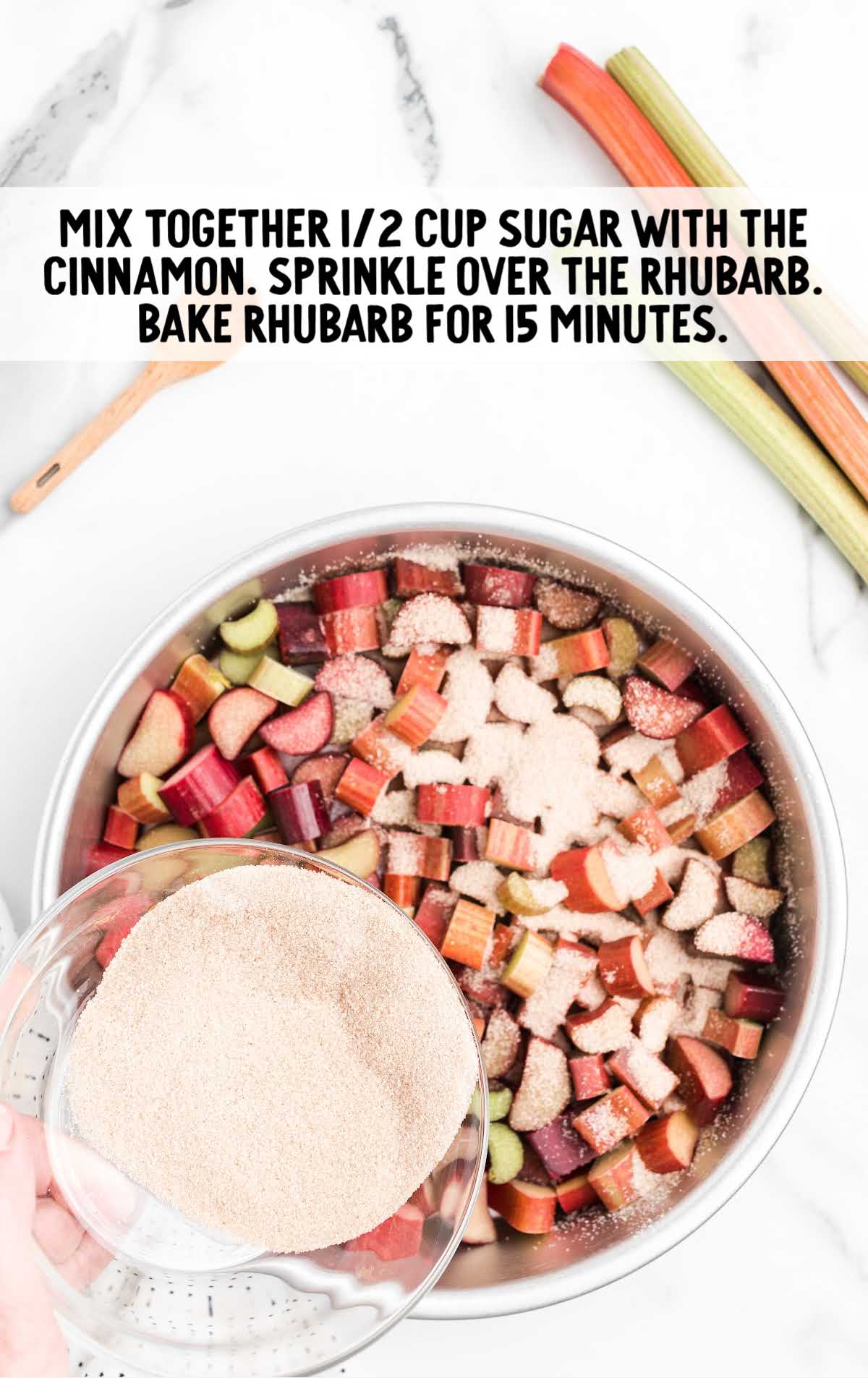 sugar and cinnamon being sprinkled over rhubarb