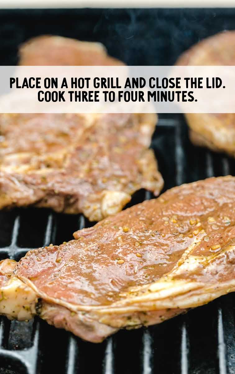 steaks placed on a grill
