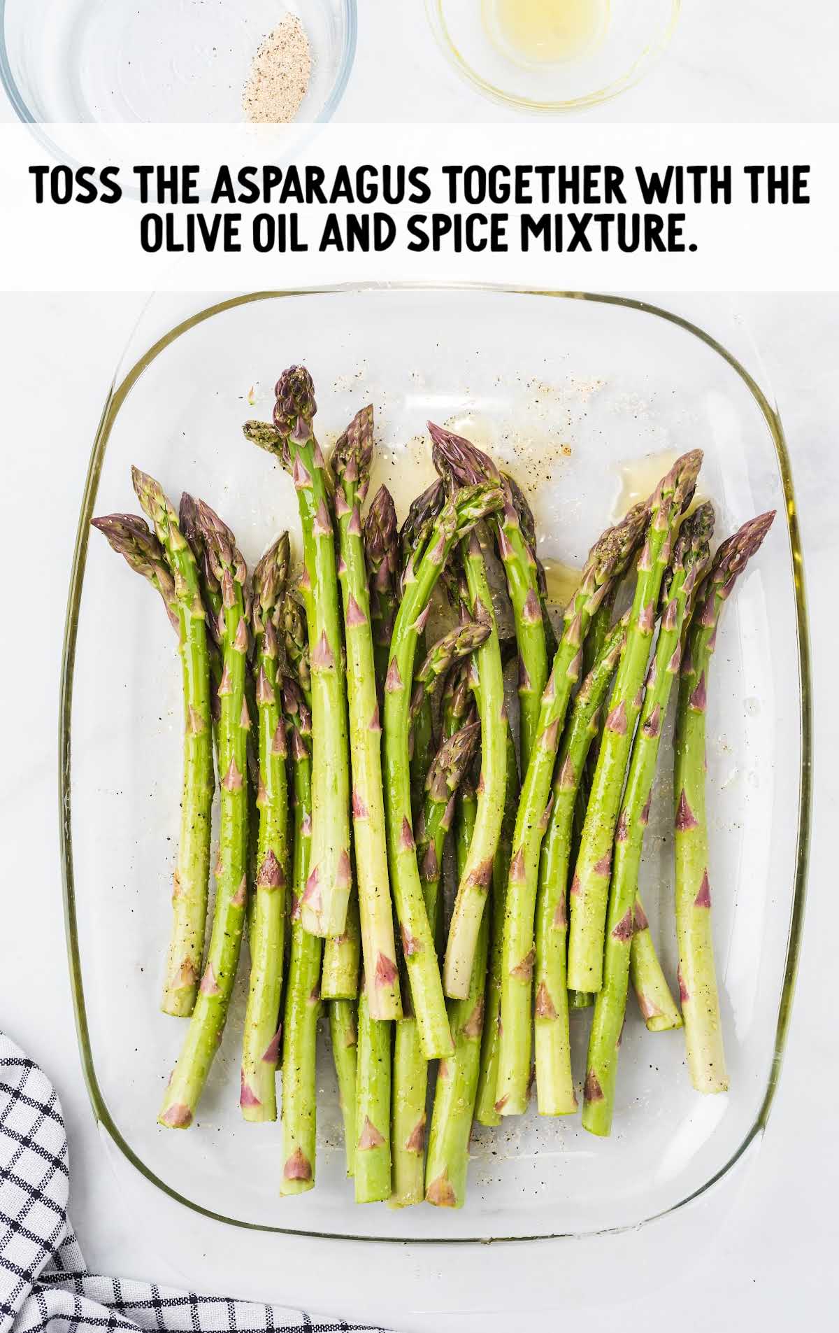 Asparagus tossed together with the olive oil and spice mixture