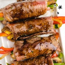 overhead shot of Balsamic Glazed Steak Rolls on a serving tray