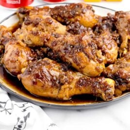 close up shot of coca-cola chicken on a plate