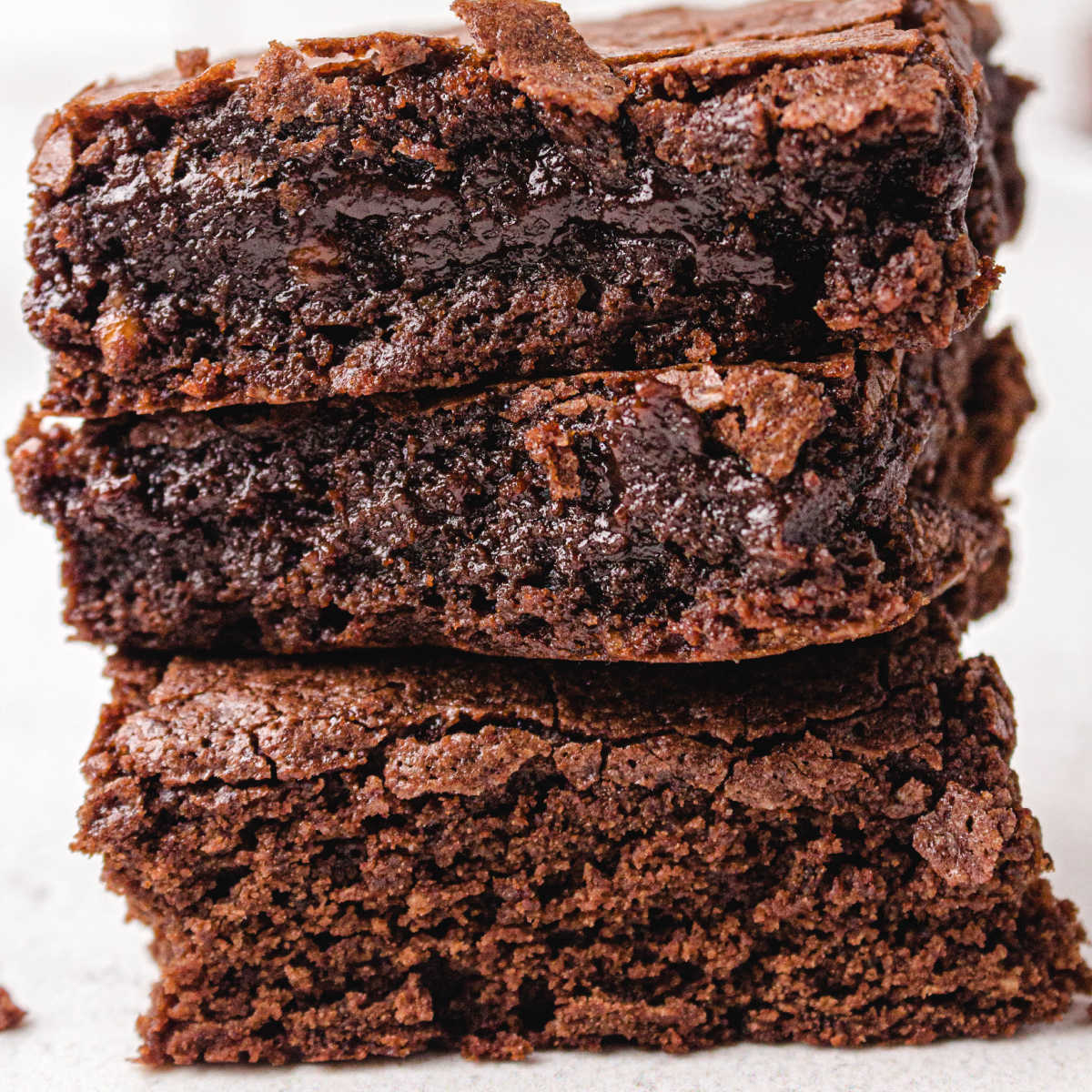 close up shot of egg white brownies stacked on top of each other