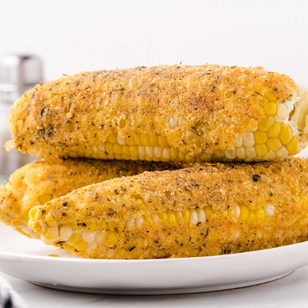 Overhead view of fried corn on the cob with a recipe title text overlay