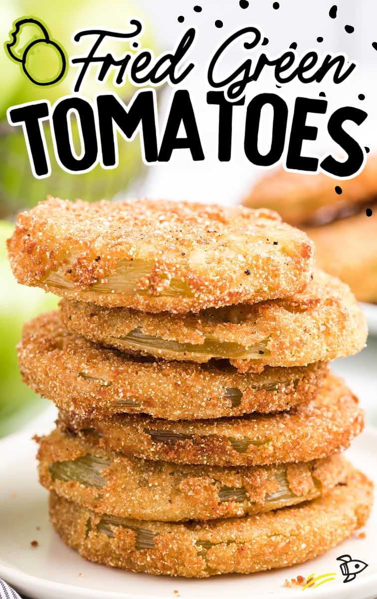 close up shot of fried green tomatoes stacked on top of each other on a plate
